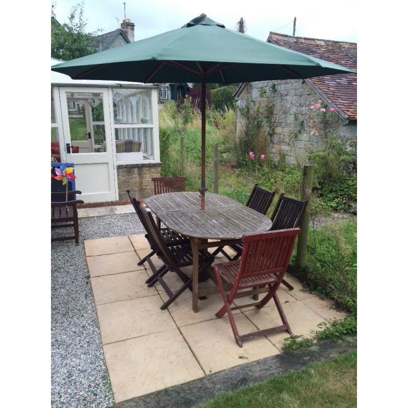 Table, chairs, and parasol