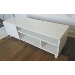 Gloss white TV stand unit with drawers and door at one end