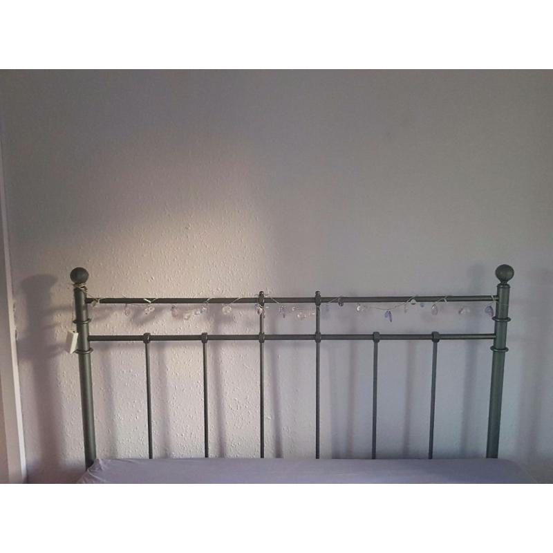 Grey metal double bed.