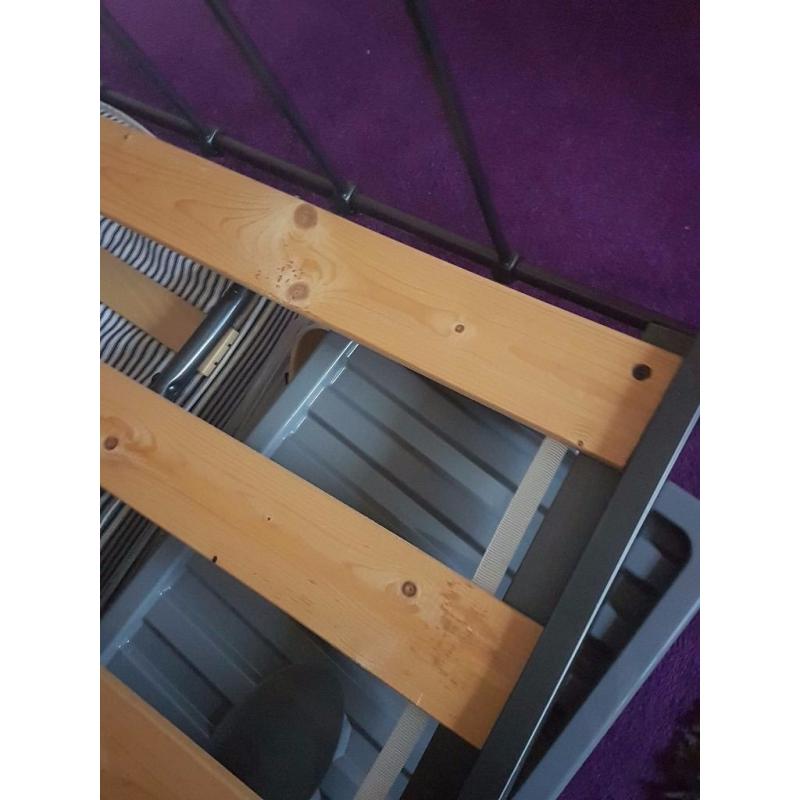 Grey metal double bed.