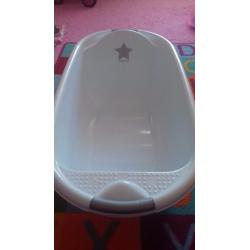 Bath and pink bath seat