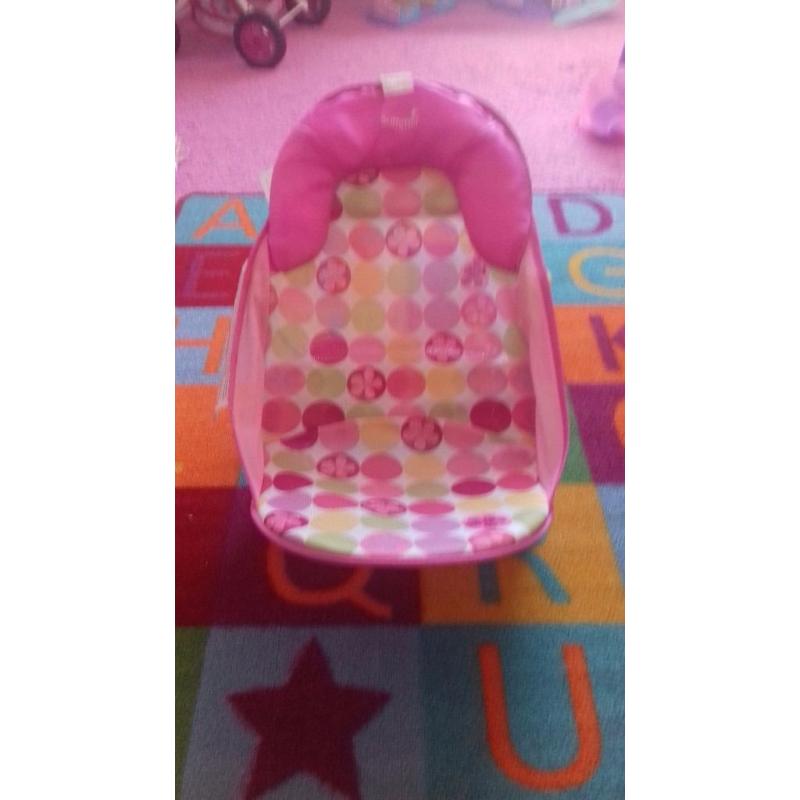 Bath and pink bath seat