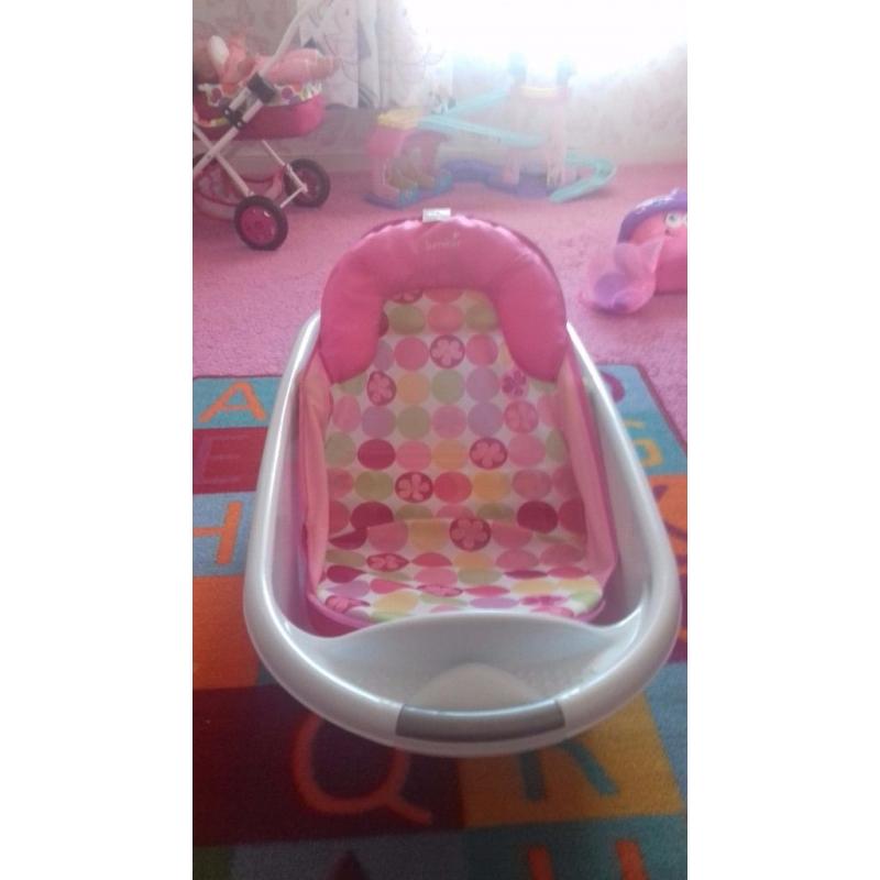 Bath and pink bath seat