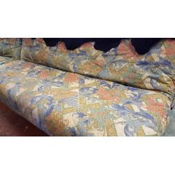 Cream and Green Floral Fabric Sofa Bed with Black Fur Rug in Excellent Condition