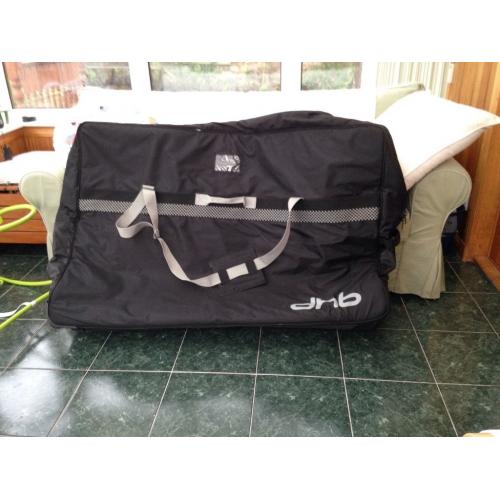 DHB soft padded bike bag with wheels on one corner for ease.