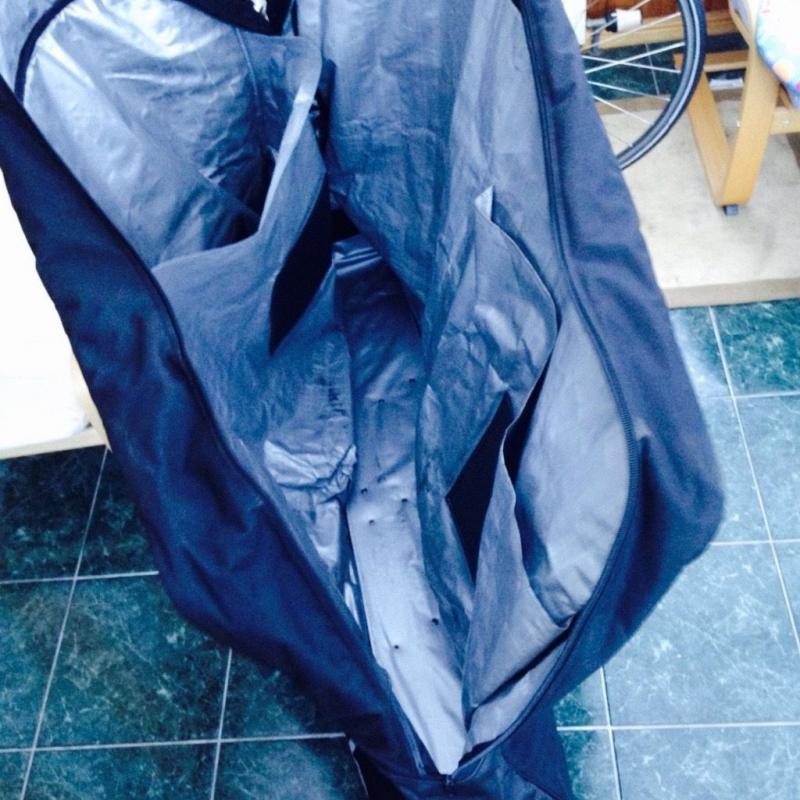 DHB soft padded bike bag with wheels on one corner for ease.