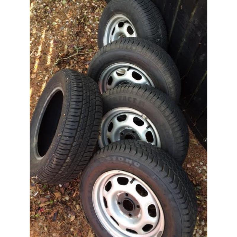 4 Tyres and steel wheels Plus spare tyre for Golf or similar 175/70 R13