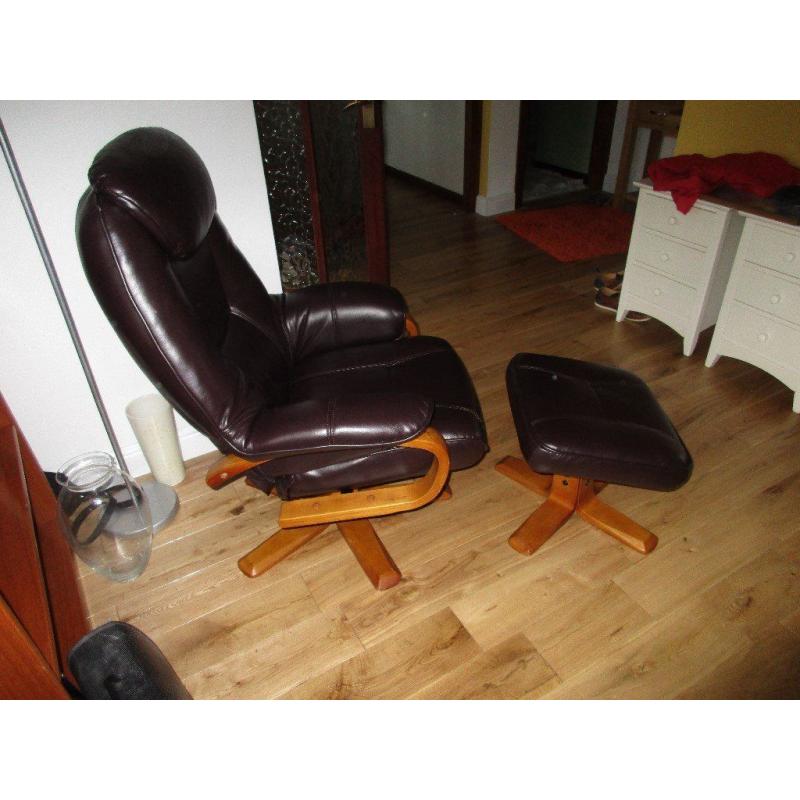 Faux leather lounger with footstool. Swivels and reclines. Hardly used, almost as new.