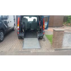 MOBILITY VEHICLE FOR WHEELCHAIR USER