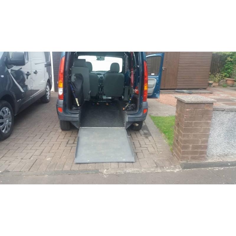 MOBILITY VEHICLE FOR WHEELCHAIR USER