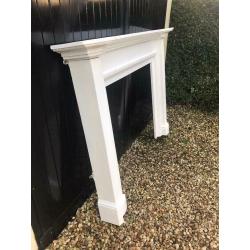 Wooden fireplace mantle painted white