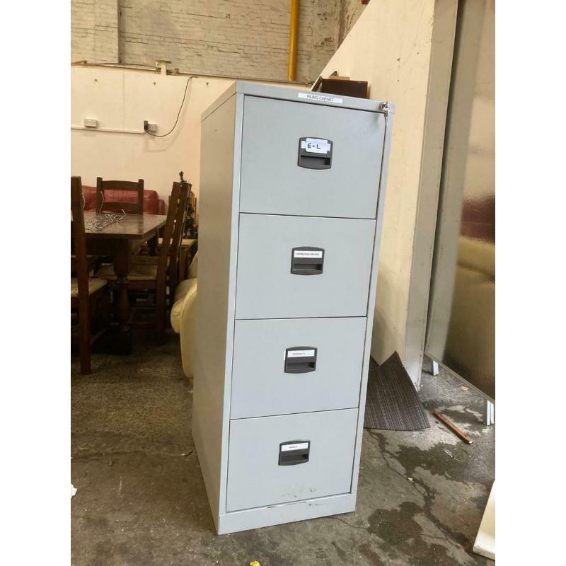 Four drawer metal filing cabinet with key