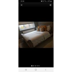 Upholstered grey kingsize bed frame