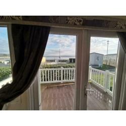 2 bedroom used static caravan FOR SALE AT TRECCO BAY WITH A SEAVIEW