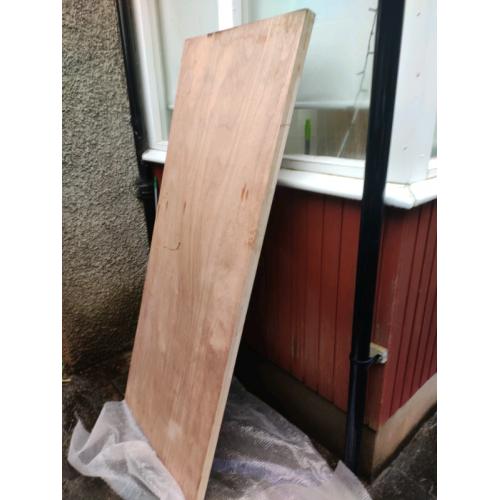 Solid wood storm door.