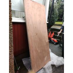 Solid wood storm door.