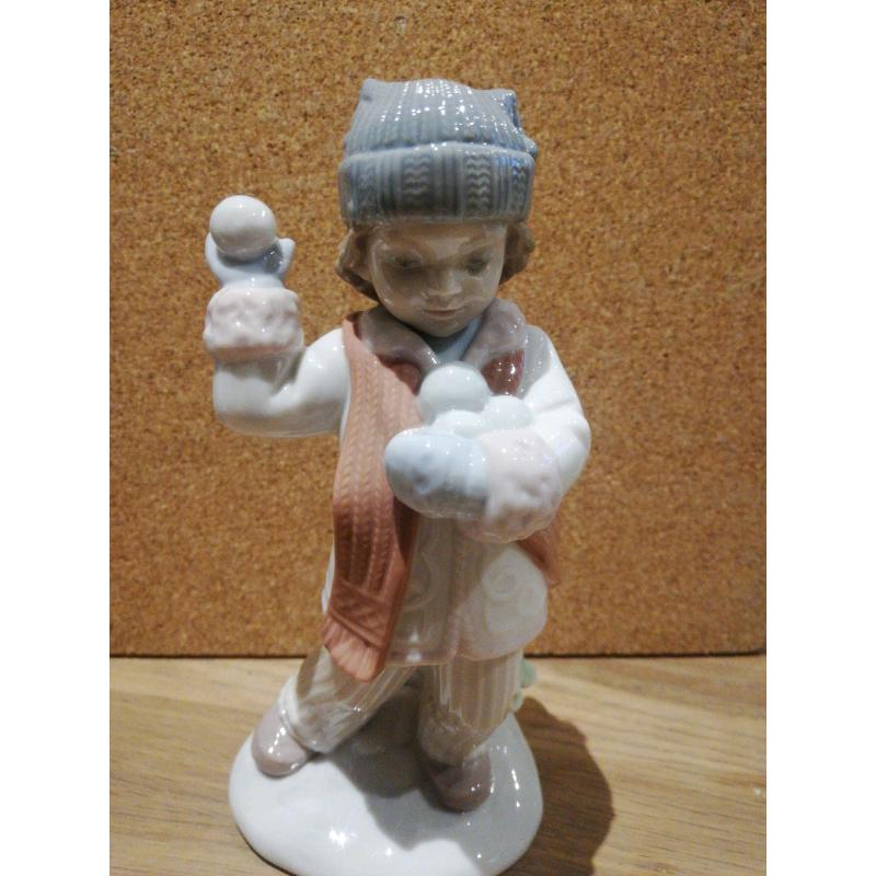 Nao / Lladro boy throwing snowballs figurine