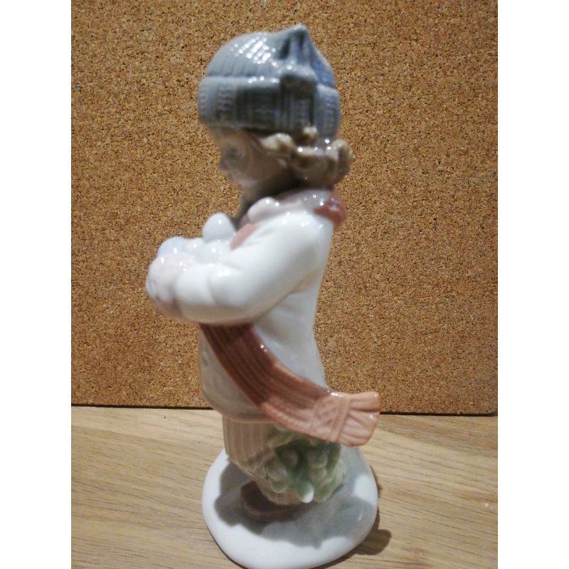Nao / Lladro boy throwing snowballs figurine