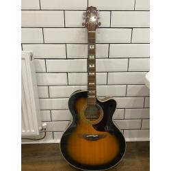 Takomine EG523SC 6 string electro acoustic jumbo guitar in sunburst.