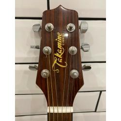 Takomine EG523SC 6 string electro acoustic jumbo guitar in sunburst.